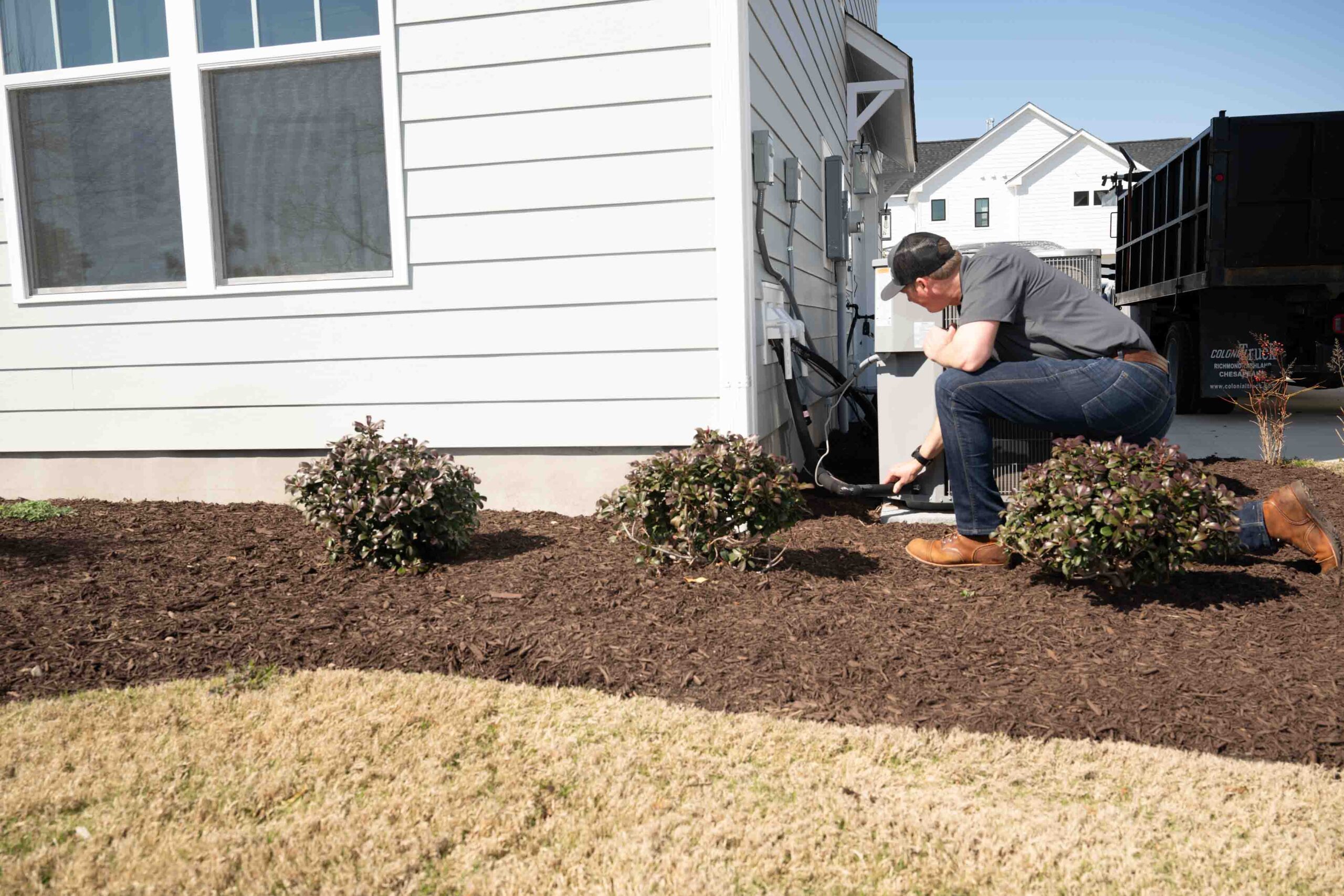Home inspector from Apex Home Inspection examining an HVAC system in a Hampton Roads, VA home during a professional inspection.